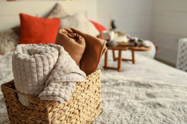 istock Wicker basket with cozy blankets, home mood 1799363390