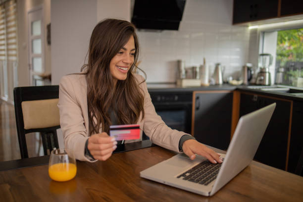 istock Happy young customer enjoys shopping online 1799375930