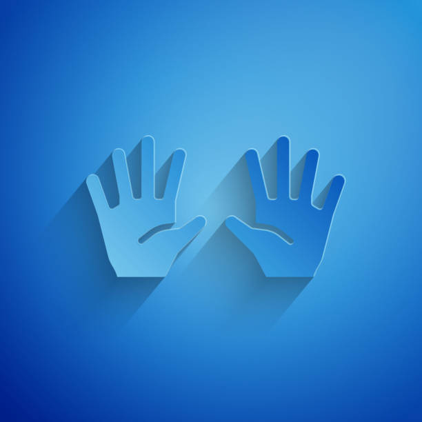 istock Paper cut Medical rubber gloves icon isolated on blue background. Protective rubber gloves. Paper art style. Vector 1799394898