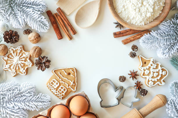 istock Bakery background with ingredients for cooking Christmas baking. Flour, eggs, cinnamon and gingerbread on the table top view 1799404404