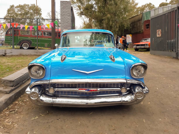 old blue 1957 chevrolet chevy bel air sport sedan two door at a classic car show in a park. - collectors car front view chevrolet bel air horizontal imagens e fotografias de stock