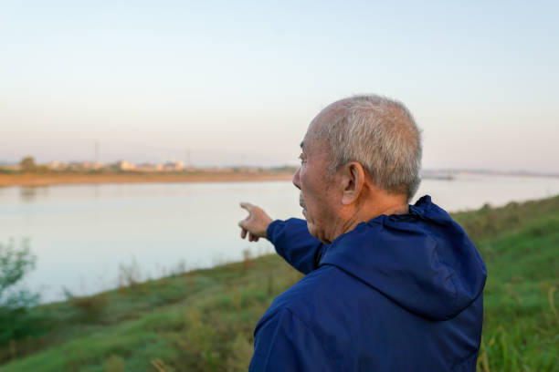old man pointing to the far away