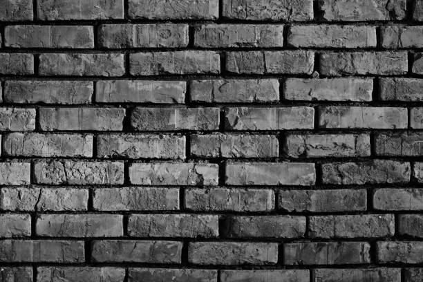 Background old brick wall in black and white photo.