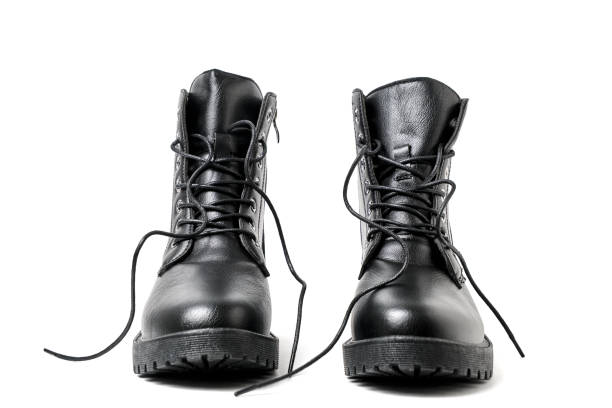 istock Pair black leather boots with laces white background. 1799495212