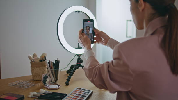 istock Closeup influencer adjusting smartphone tripod at home. Online learning concept 1799524416