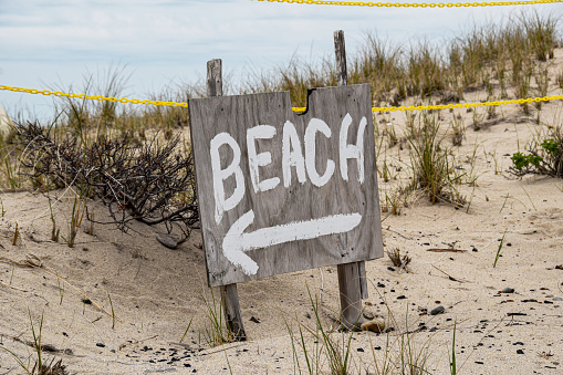Wooden Sign for the Beach Near Sand Dunes