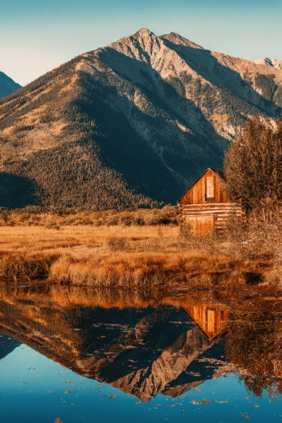 istock Rustic Twin Lakes Colorado Barn and Mountain Reflection 1799531771