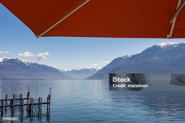 Alpine Lake With Parasol Stock Photo - Download Image Now - Sunshade, Beach Umbrella, Below