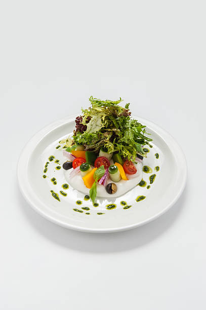 istock Greek salad on a white plate 179972068