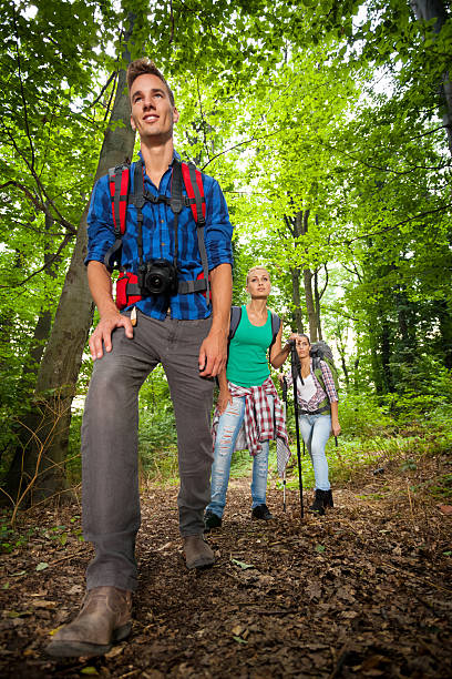 istock man on a mountain trail with friends 179974217