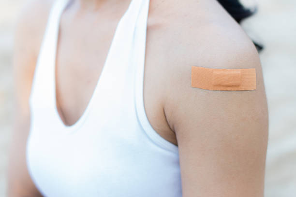 istock woman arm with an adhesive bandage 1799751278