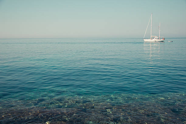 Lonely sailing boat in Favignana Sicily Italy stock photo