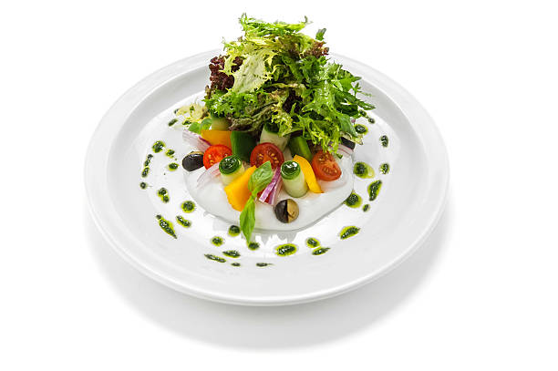 istock Greek salad on a white plate 179980086