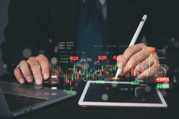 istock Stock market investment analysis using tablets and trading data for financial success Business index statistic increase investment with chart and graph exchange fund 1799806882