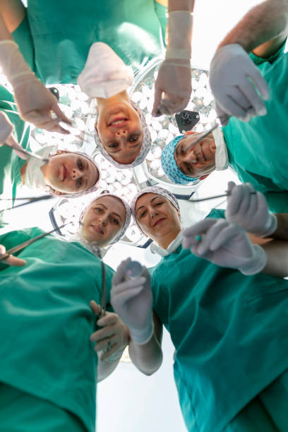 istock Team of nurses and surgeons in surgery. 1799827575