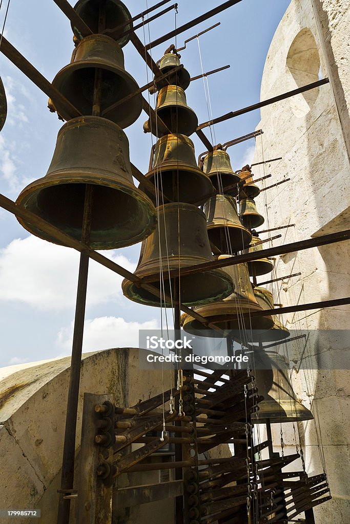 Bells of La Colegiata Once you climb the stairs of the bell tower of La Colegiata de Xàtiva, it is possible to see the bells, which several times a day. since 1877, they resonate in the city. 2013 Stock Photo