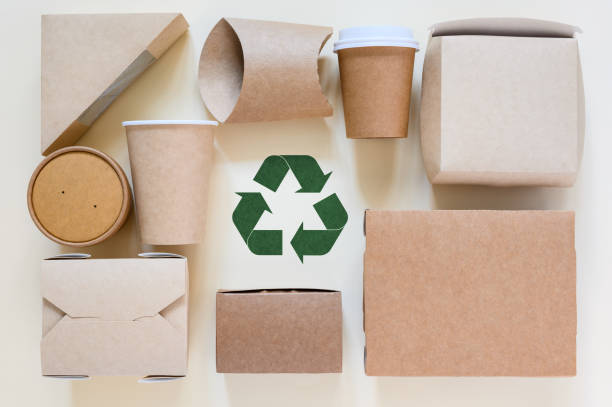 istock Green recycling sign and a set of eco-friendly disposable tableware. Zero waste concept for sustainable living 1799897938