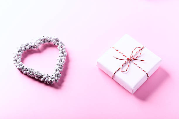 istock Christmas present on bright paper background. Close up. Copy space. 1799912027