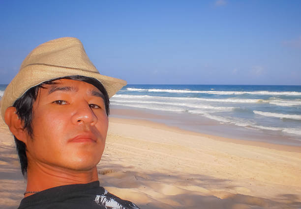 istock The man wear a hat at Surfer Paradise beach 179991519