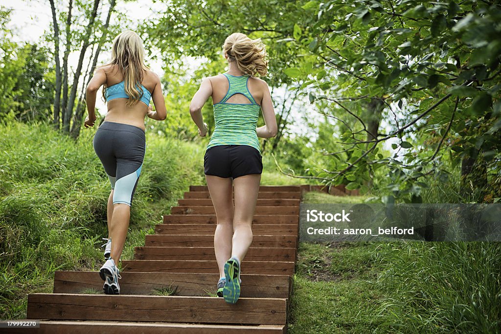 Two Women Jogging Two Women Jogging Up The Staircase Active Lifestyle Stock Photo