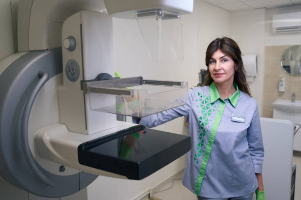 istock Radiologic technologist posing for camera among diagnostic equipment in clinic 1799925827