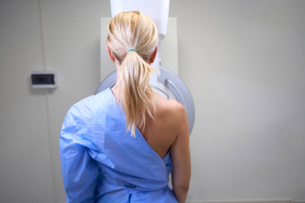 Female patient is undergoing diagnostic mammogram on modern equipment