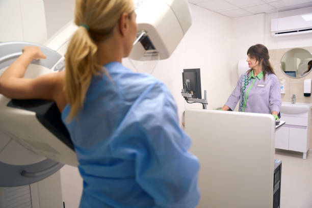 istock Female is getting 3D mammogram during diagnostic examination in clinic 1799926175