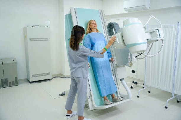 istock Patient being prepared for diagnostic radiography by experienced radiographer 1799926806