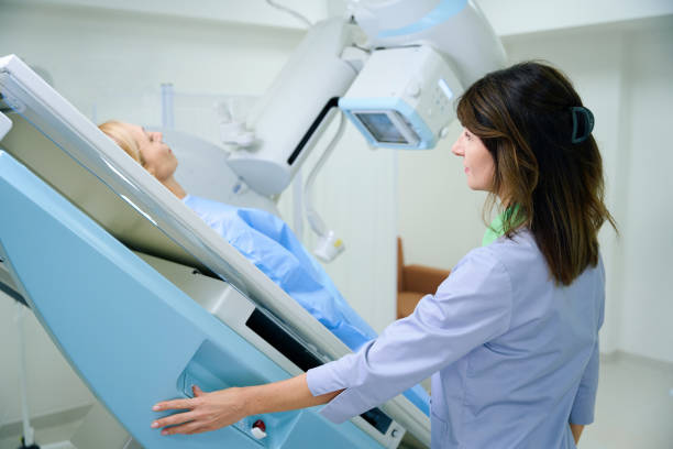 istock Radiologic technologist is preparing female patient for radiological examination 1799926818