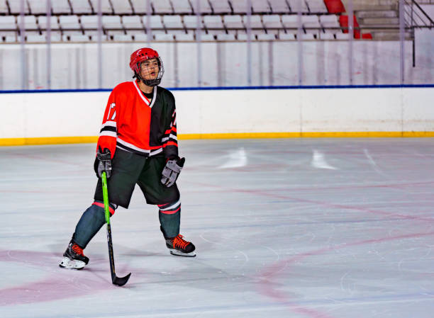 istock tired female ice hockey player 1799966082