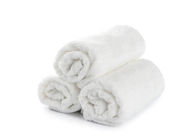 istock Three fresh, white towels, rolled and stacked 179996943