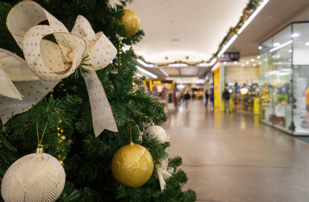 istock Shopping mall with Christmas decorations. Unrecognizable people walking along the shops. Auckland. 1799971330