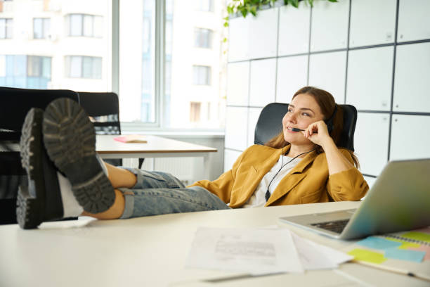 istock Female freelancer communicates online in a coworking office area 1799982503