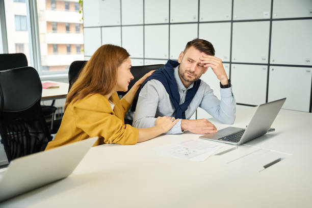 istock Young manager consoles a male colleague 1799983667