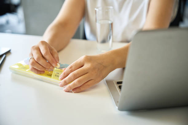 istock Woman sits at her workplace 1799984070