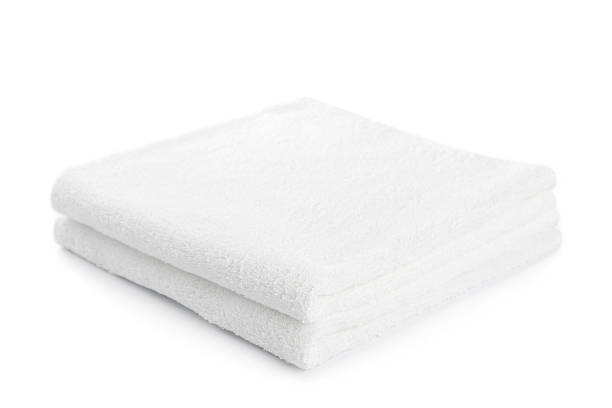 istock Two white bath towels neatly folded on a white background 179999978