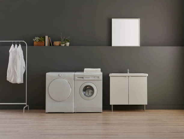 istock Bathroom, laundry, washing and dry machine, sink cabinet, mirror and object, grey wall background. 1800010844
