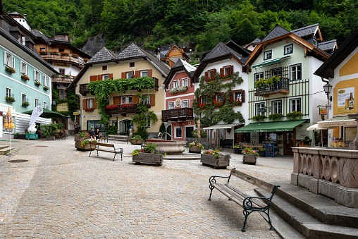 Hallstatt, Austria, July 9, 2022: View of the town square in the picturesque small town of Hallstatt in Upper Austria. The town on the shore of the lake Hallstätter See  is listed as UNESCO World Heritage Site.