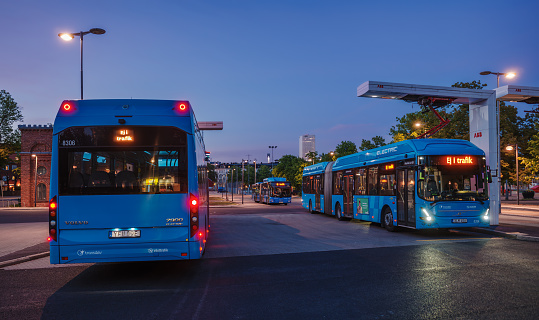 Gothenburg, Sweden - May 30, 2023: Volvo electric buses being charged at the ABB electric charging station in Gothenburg