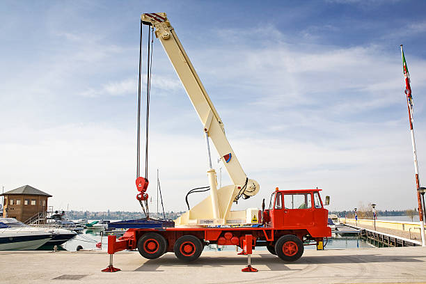 crane for yacht Mobile crane with lifting boom up crane machinery stock pictures, royalty-free photos & images