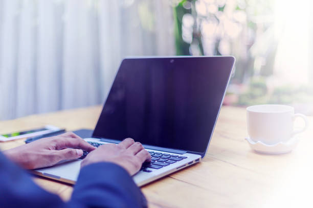 istock Businessman uses laptop to search information on the internet on his notebook computer. digital technology Digital investing is all about successful investing. 1800076163