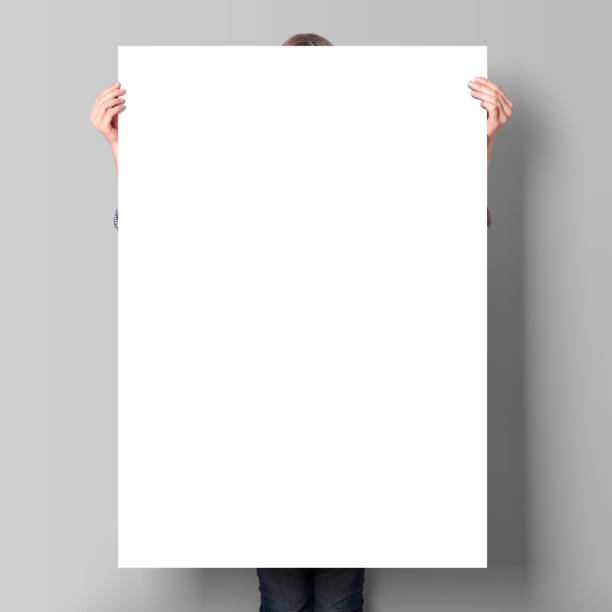 istock A Woman Holding an Empty Poster Mockup 1800090807