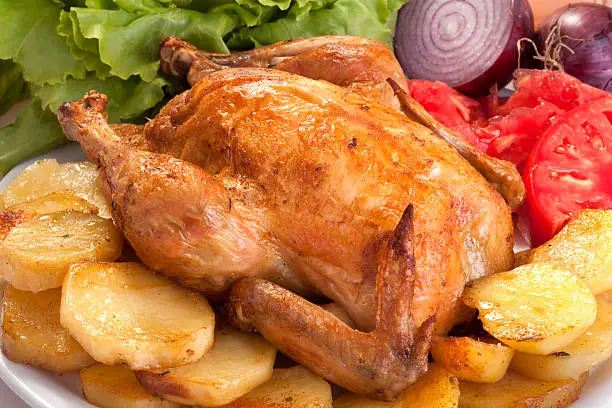 roast chicken with potatoes, vegetables and salad