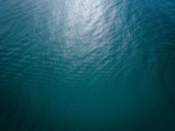 istock Aerial view of the sea surface reflecting the sun 1800109909