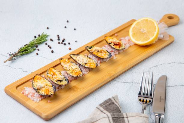 istock baked mussels with parmesan and lemon side view 1800117919