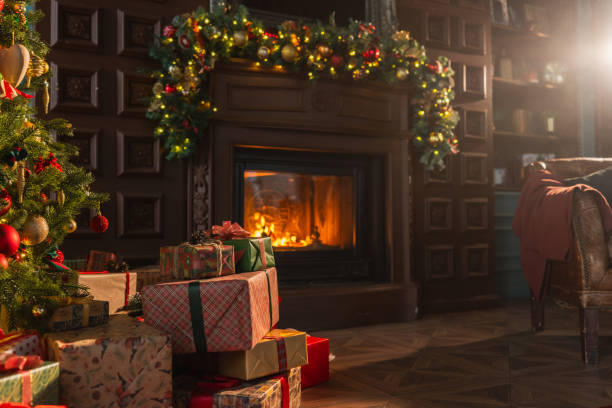 istock Classical Christmas decorated interior living room library with fireplace. Christmas tree with red golden ornament decorations. Modern classic style interior design apartment. Christmas eve at home. 1800117945