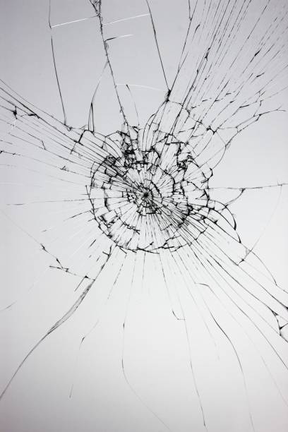 istock Cracks on the glass on a white background. Broken window. 1800125400