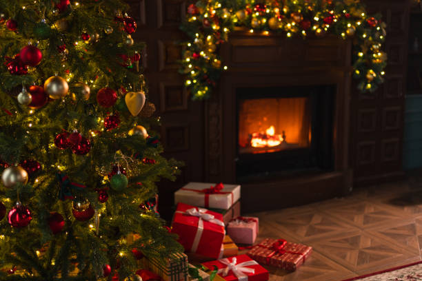 istock Classical Christmas decorated interior living room library with fireplace. Christmas tree with red golden ornament decorations. Modern classic style interior design apartment. Christmas eve at home. 1800132232