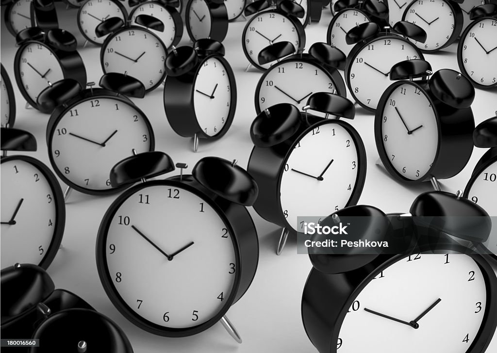 many alarm clock many alarm clock  on a gray background Alarm Clock Stock Photo