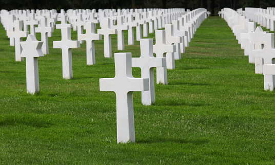Colleville-sur-Mer, FRA, France - August 21, 2022: American Military Cemetery and many white crosses and David star on the graves